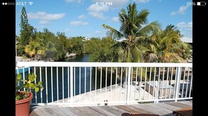 The open porch with view down the canal. Only 5 minutes to Pine Channel
