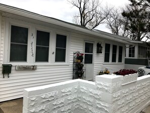 Front of our cottage - sidewalk to  the beach is on the left