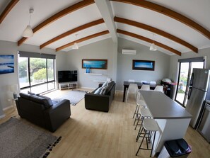 Big open plan kitchen, dining and living area with large screen TV with Netflix.