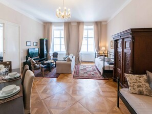 Living room, dining corner, 1 single bed+ 1 single/double bed on the right 