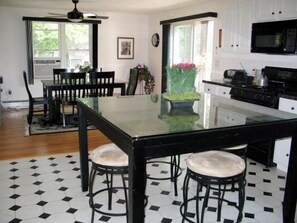 Slate kitchen island & granite dining room table.
Seating for 10.