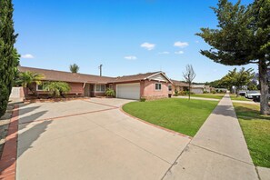 Spacious front yard with driveway that can accommodate two RV or four cars.