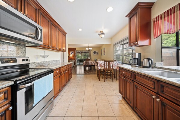 A coffee maker, toaster, knife set, pots and pans, dishes, wine glasses, etc.