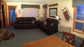 Living Room with reclining leather couches and Loaf decor.