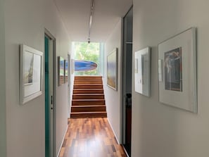 Downstairs with bedrooms and bathrooms off the hall.