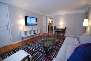 Brookwood Courtyard Condos - Stylish Living Room with 50-inch LED TV