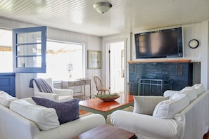 Open the door for the ocean breeze or light fire on a chilly night