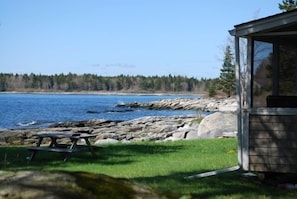 Enjoy the ocean breeze from the screened-in porch...