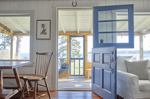 Dutch Doorway leading out to the screened-in porch and the lawn by the ocean