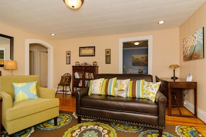 LIVING ROOM - Comfortable seating for six with bookcase, desk / computer center