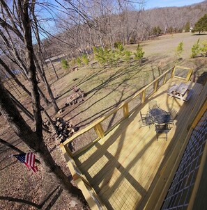 Upper deck view off the rec room with seating on the balcony.