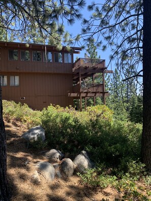 looking up at the side of house from the trail that heads down to Meeks Bay