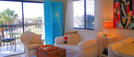 Great funky living room with beach colors and white canvas.