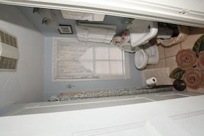 Bathroom with shower and linen closet 