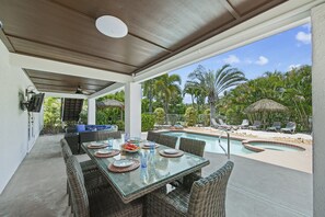 Lux Outdoor Dining Table for 8 next to Outdoor Shower