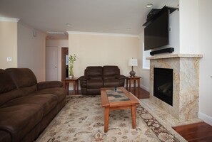 Reclining sofas, 50" Vizio, HDTV with internet access and premium cable package