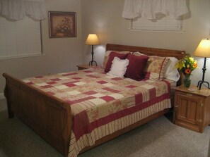 Master bedroom offers Cal King oak sleigh bed