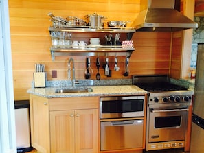 Brand new kitchen with granite counter-topcs and stainless appliances.