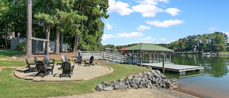 fire pit, covered boat house, boat dock , boat ramp and swim platform