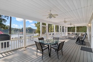 large furnished screen back deck with water views