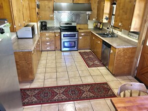 Stocked kitchen w/ all you need to do the cooking. Just bring the food & foil. 