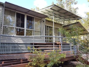 Front view, wrap around balcony. Large windows allows lots of natural light
