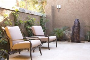 private travertine entry courtyard with fountain