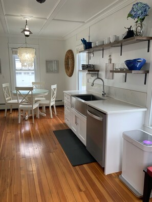 Beach House Kitchen featuring keurig, blender, coffee maker, tea kettle, etc.