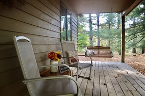 Relaxing sitting area on porch with swing during Summer/Fall