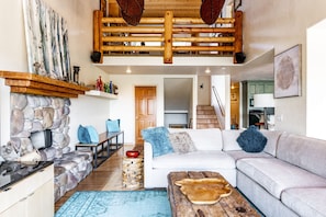 Main living area with fireplace - panoramic mountain views