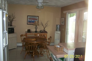 Kitchen/dining area with sliding door to screened in deck