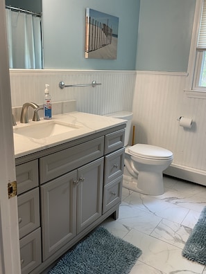 New updated bathrooms with marble floors & vanity.