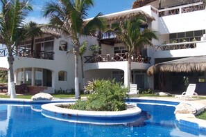 View of our patio next to palapa .  Just walk out and you are pool-side !