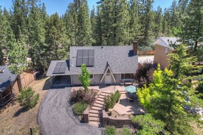 Pine Cone Alley.  Carport to left and front patio to right.