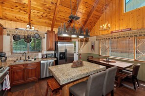 Well stocked kitchen with cozy island.