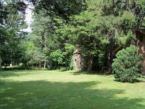 View of the peaceful back yard with the old pigeonnier (pigeon tower)
