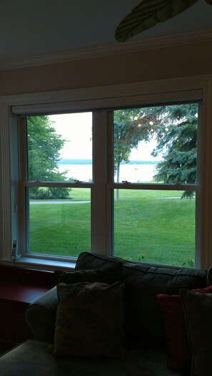 View from Living Room of bicycle trail and water in bay.