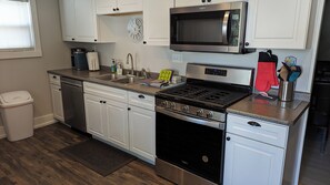 Kitchen with stainless steel appliances. 