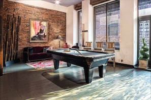 Large balcony overlooking Printers Alley with a Pool table