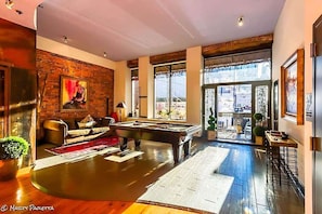 Large balcony overlooking Printers Alley with a Pool table