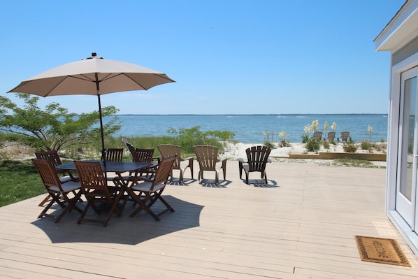 Deck surrounded by the water and your own private sandy beach