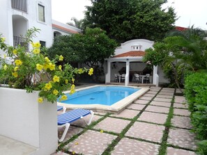 Refreshing pool, lounge area and the outdoor kitchen/dining area. 