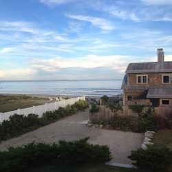 View from Primary Bedroom and path to Jenness Beach. Isle of Shoals in distance.