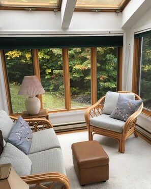 Sunroom off the kitchen, facing the back deck and mountain views.