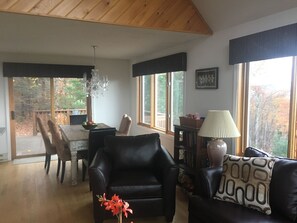 Open dining area, part of living room and deck