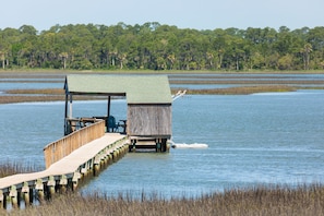 Covered Dock with water, electricity, refrigerator, picnic table, dock house.