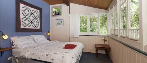 Main bedroom (queen bed) with views to the forest