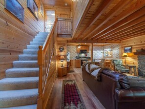 Welcome view of front entry to living room and stairs to bedroom and bathroom