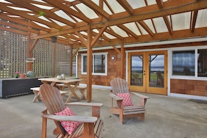 Expansive Lanai with massive wood burning fireplace, BBQ and dining area.