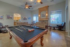 Become a pool shark on your vacation by practicing pocket shots on the pool table.